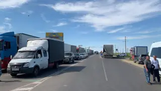 Where will electronic queuing system be implemented for entry into Kazakhstan?