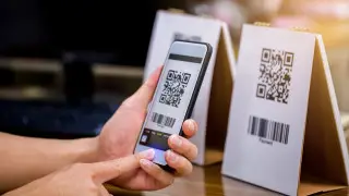 When will Kazakhstan introduce a unified QR code for all banks?