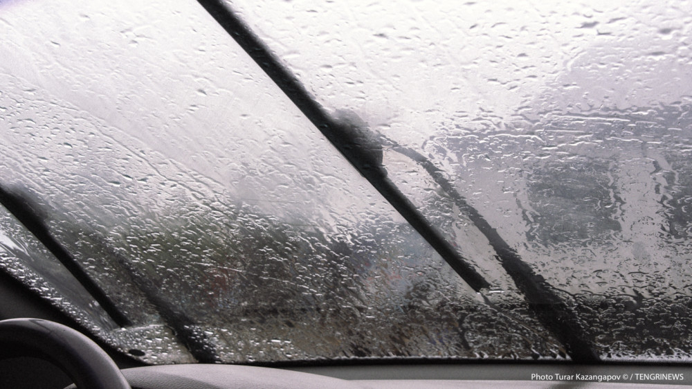 Which cities in Kazakhstan will be hit by stormy winds and rain