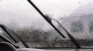 Which cities in Kazakhstan will be hit by stormy winds and rain