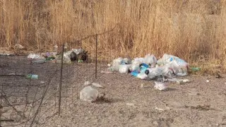 Kazakh woman outraged by piles of trash at popular reservoir