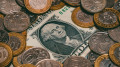 Dollar falls below psychological threshold in trading